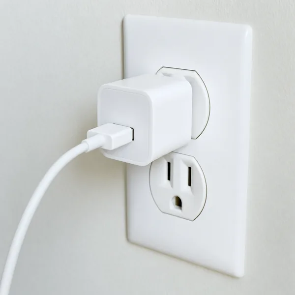 A USB phone charger in a wall outlet