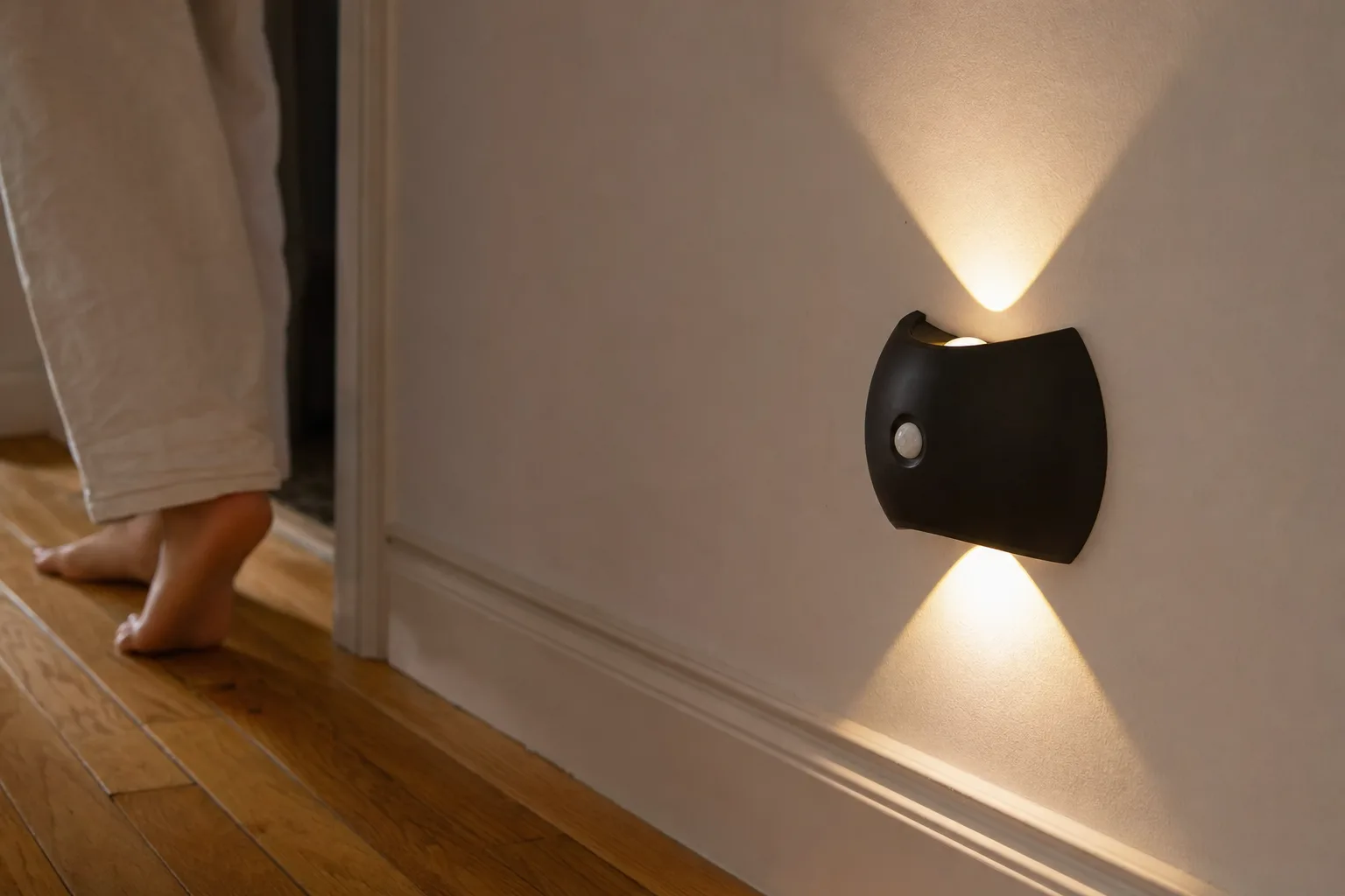 The wall light switching on as someone walks past